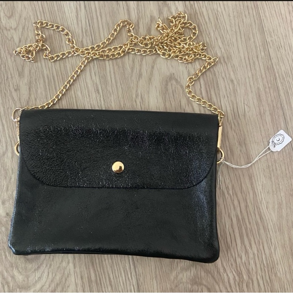 Black leather clutch. Bought in Spain
